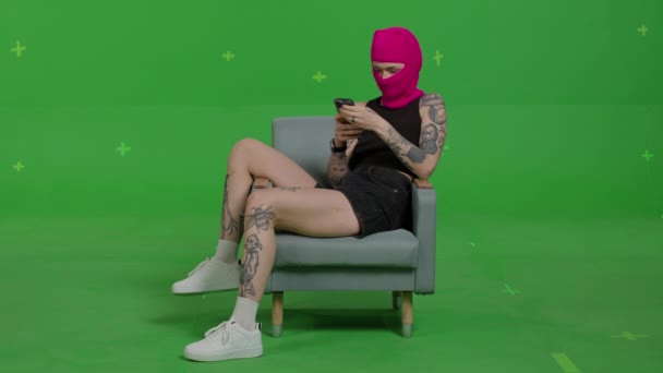 Young woman in pink balaclava — Stock Video