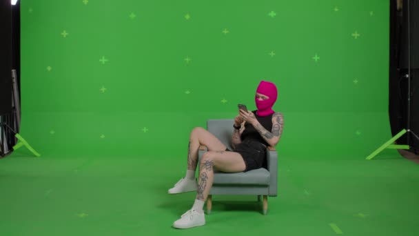 Young woman in pink balaclava — Stock Video