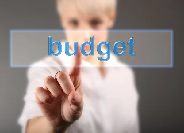 Finance concept - business woman touching screen with Budget sign — Stock Photo, Image