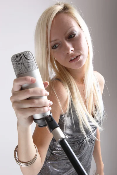 Portrait of a girl with a microphone — Stock Photo, Image