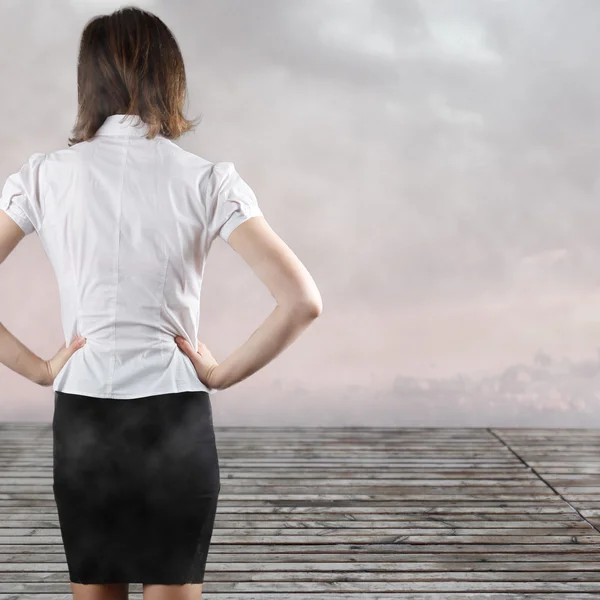 Standing beautiful brunette backside — Stock Photo, Image