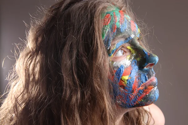 Jovem mulher com face-art — Fotografia de Stock