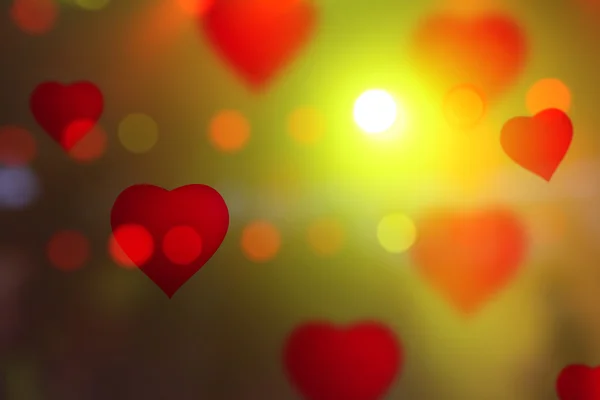 Kalpler bokeh arka plan üzerinde renkli — Stok fotoğraf