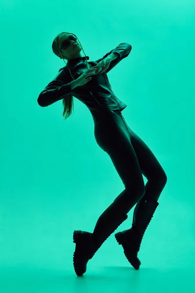 sexy girl in green lighting in plastic poses