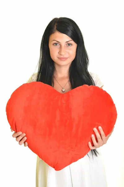 Attraktiv leende kvinna med hjärta på vit bakgrund — Stockfoto