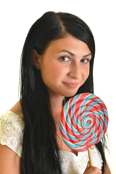 Pretty young woman with lollipop candy isolated on white background — Stock Photo, Image