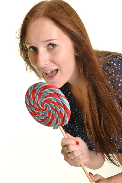 Woman with a lollipop, isolated against white — Stock Photo, Image