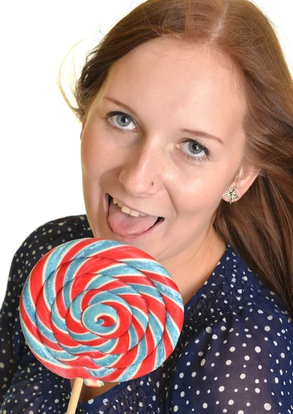 Woman with a lollipop, isolated against white — Stock Photo, Image