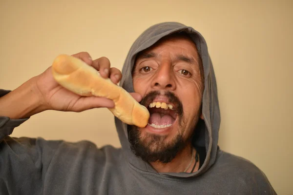 Gangster eating roll — Stock Photo, Image