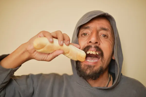 Gangster eating roll — Stock Photo, Image