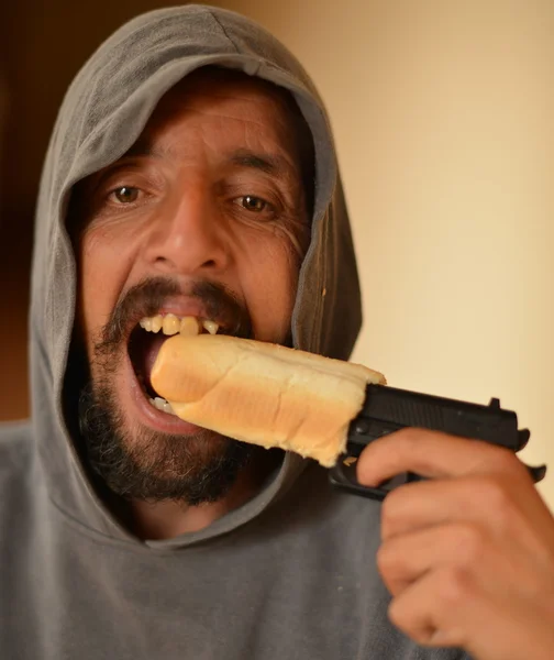 Gangster eating roll — Stock Photo, Image