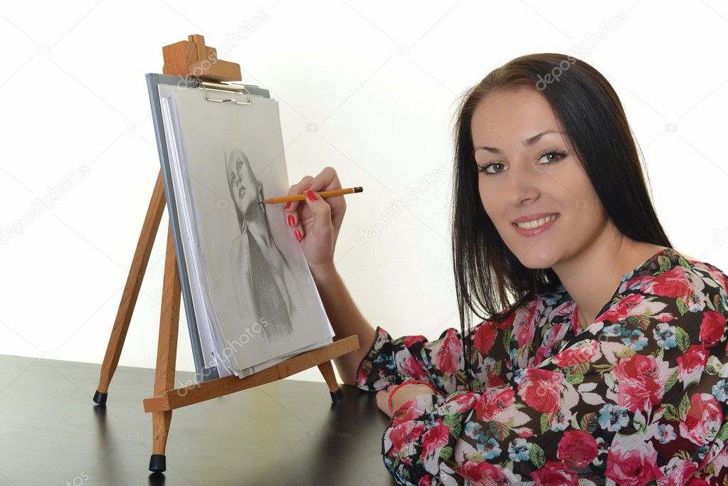 Woman painting with pencil on canvas for fun at home