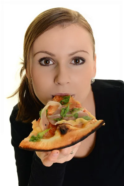 Ritratto di una giovane donna che mangia una pizza su uno sfondo bianco Foto Stock Royalty Free