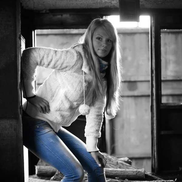 Young woman standing near a train — Stock Photo, Image