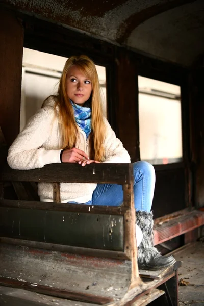 Young woman standing near a train — Stock Photo, Image