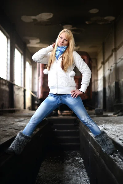 Young woman standing near a train — Stock Photo, Image