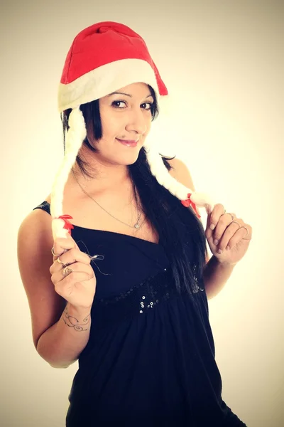 Mulher feliz com chapéu de Santa em um fundo branco — Fotografia de Stock