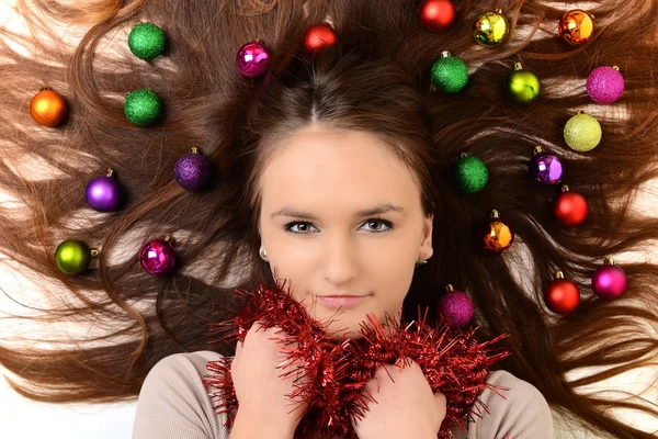 Lovely woman with christmas balls — Stock Photo, Image