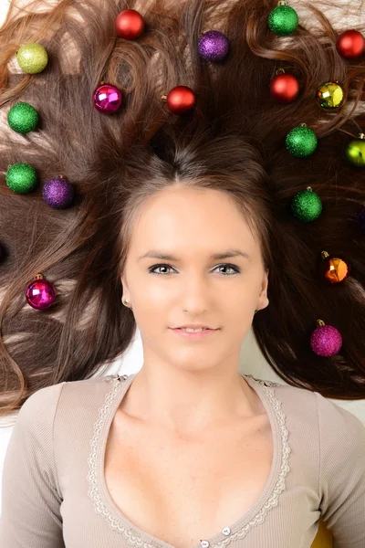 Lovely woman with christmas balls — Stock Photo, Image