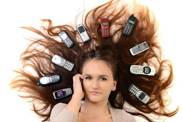 Retrato de mujer feliz con teléfonos móviles — Foto de Stock