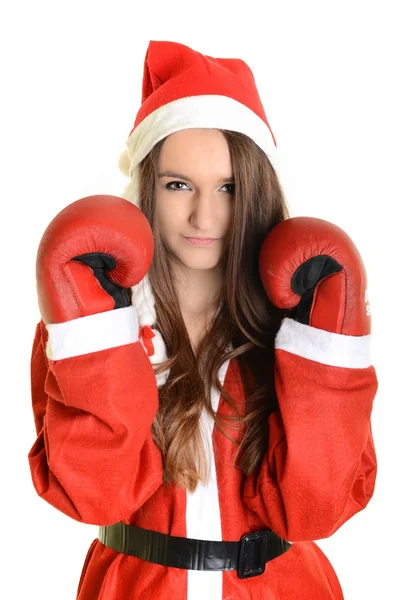 Boże Narodzenie kobieta uderzenie sobie Rękawice bokserskie i czerwony kapelusz santa — Zdjęcie stockowe