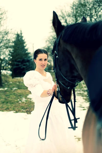 Novia con un caballo Imagen De Stock