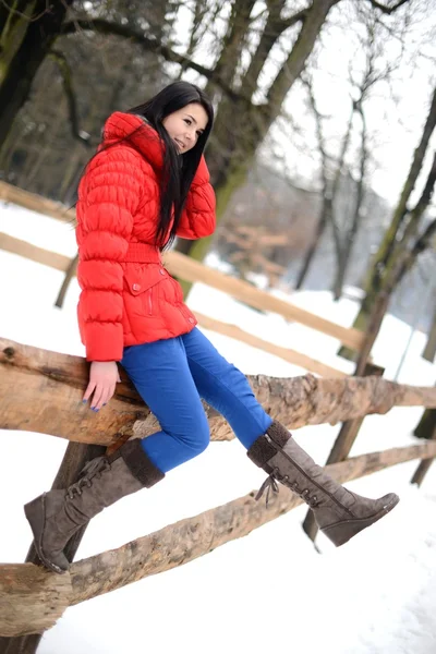 Young woman near the fence — Stock Photo, Image