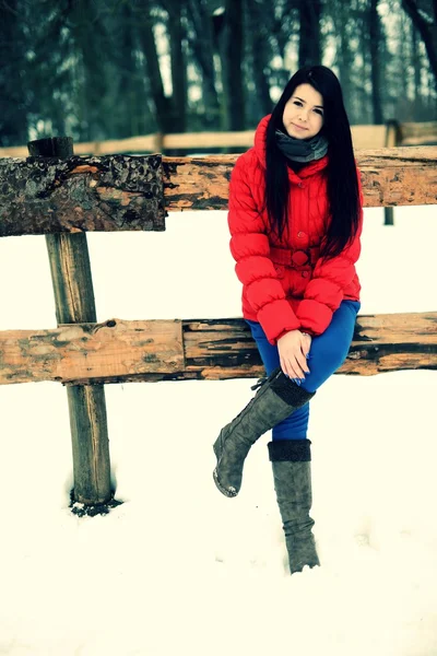 Young woman near the fence — Stock Photo, Image