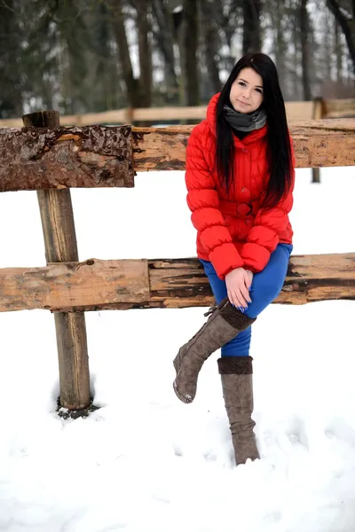 Young woman near the fence — Stock Photo, Image