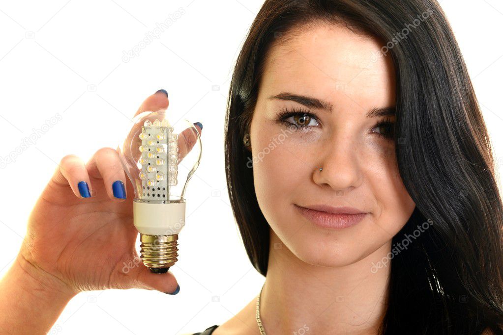 woman holding led bulb.
