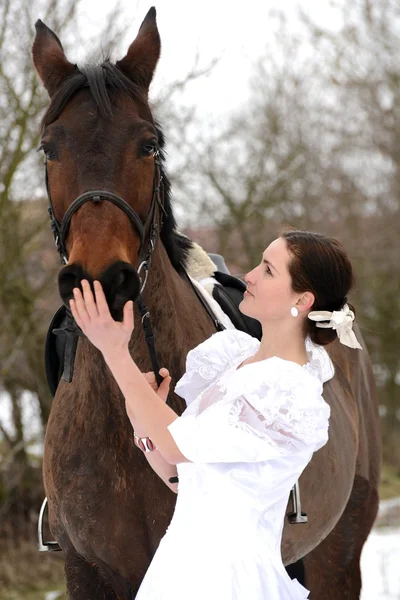 Portrait of a beautiful bride and horse — Stock Photo, Image