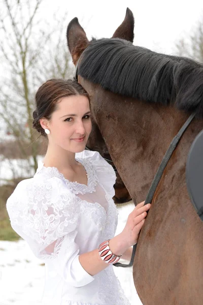 Portrait of a beautiful bride and horse — Stock Photo, Image