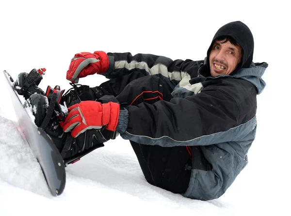 Jovem tentando andar de snowboard — Fotografia de Stock