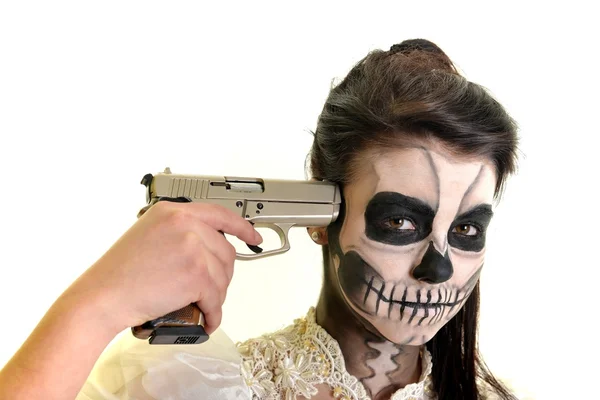 Girl with painting dead mask skull with gun — Stock Photo, Image