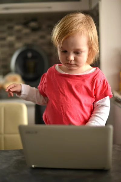 Cute child using laptop — Stock Photo, Image