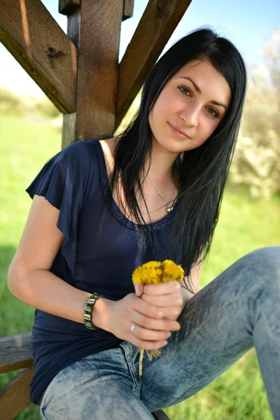 Beautiful woman with dandelion — Stock Photo, Image