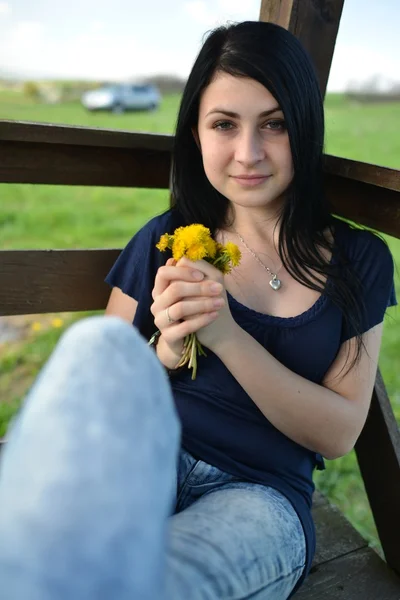 Beautiful woman with dandelion — Stock Photo, Image