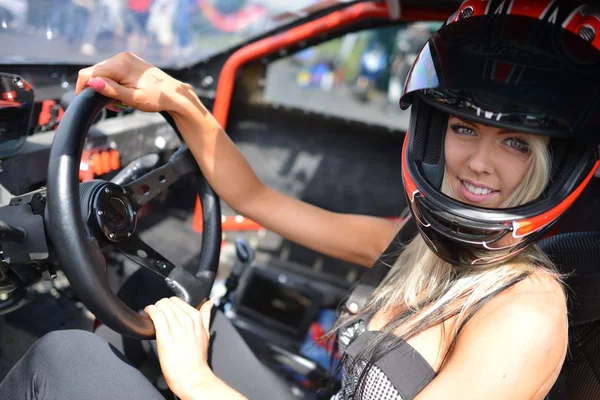 Beautiful woman sitting in the sport car — Stock Photo, Image