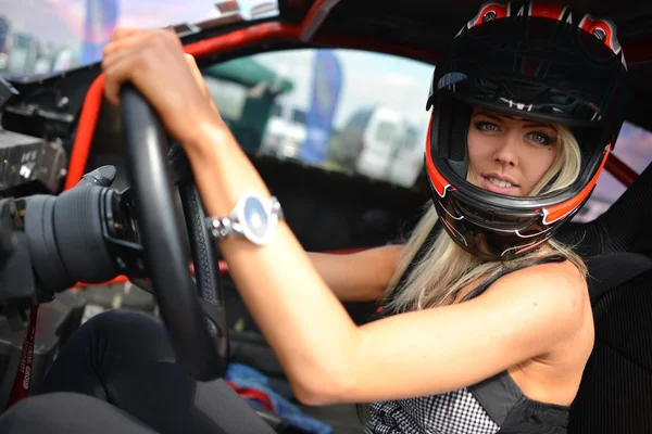 Beautiful woman sitting in the sport car — Stock Photo, Image