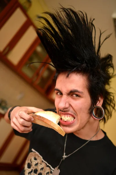 Punk boy eating — Stock Photo, Image