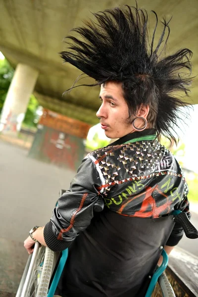 Punk boy in a wheelchair — Stock Photo, Image