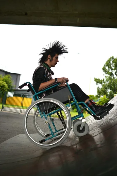 Punk boy in a wheelchair — Stock Photo, Image