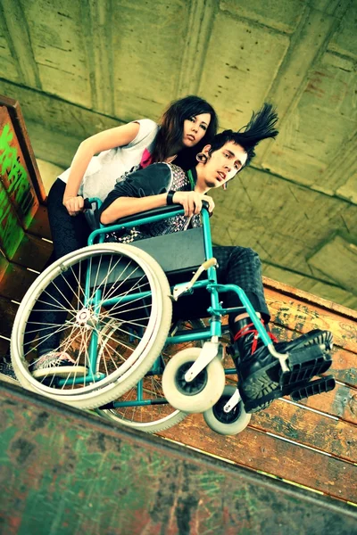 Punk boy in a wheelchair — Stock Photo, Image