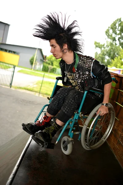 Punk boy in a wheelchair — Stock Photo, Image