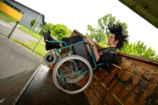 Punk boy in a wheelchair — Stock Photo, Image