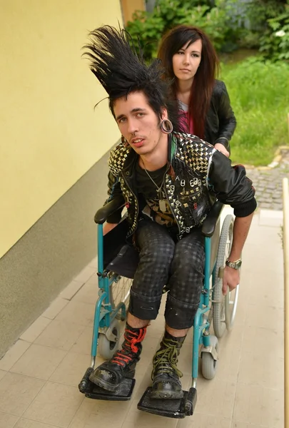 Punk boy in a wheelchair — Stock Photo, Image