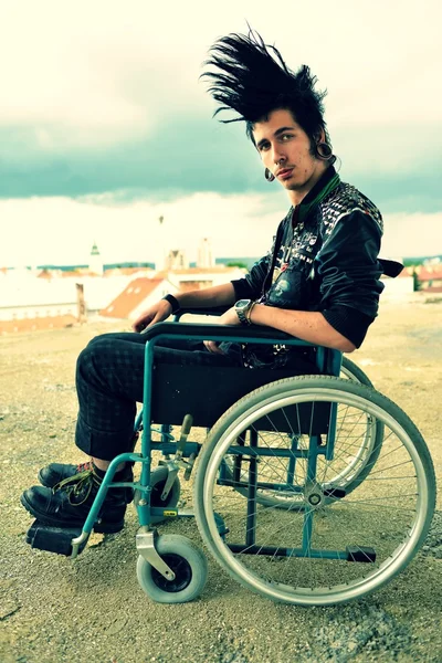 Punk boy in a wheelchair — Stock Photo, Image