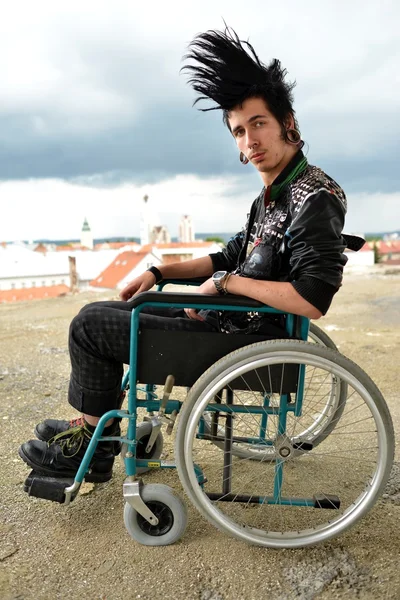 Punk boy in a wheelchair — Stock Photo, Image