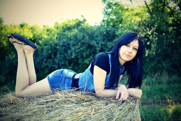 Young woman on the hay — Stock Photo, Image