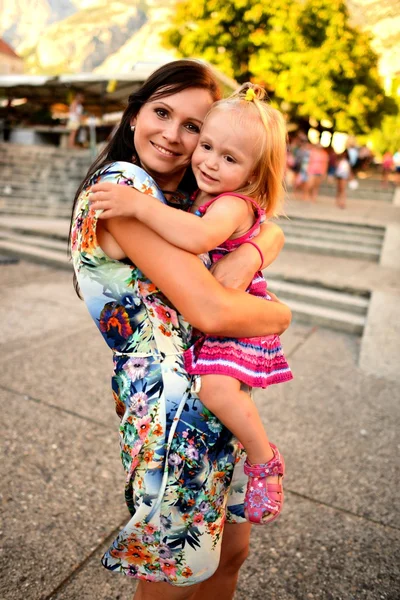 Young mother with child outside on a summer day — Stock Photo, Image